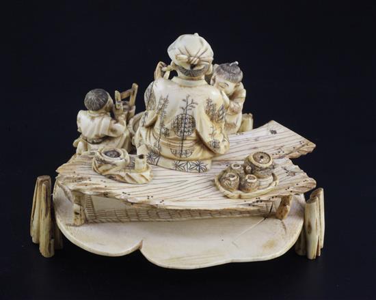 A Japanese ivory okimono of a man and two boys, signed Shomi, Meiji period 13cm, some faults